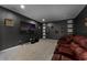 Enjoy movies in this home theater featuring leather seating and a large screen for entertainment at 2275 Pearl Cider St, Orlando, FL 32824