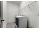 The laundry room is equipped with a modern washer and dryer, and includes a wire rack shelf at 2275 Pearl Cider St, Orlando, FL 32824