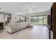 Spacious living room with tile floors and sliding glass doors leading to the backyard at 2275 Pearl Cider St, Orlando, FL 32824