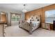 Opulent main bedroom with decorative wall paneling, chandelier and ample natural light from two windows at 2275 Pearl Cider St, Orlando, FL 32824