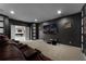 Luxurious media room complete with comfortable seating, large screen, and integrated surround sound system at 2275 Pearl Cider St, Orlando, FL 32824