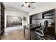 Well-appointed home office with a built-in desk, ample storage, and a view of the adjacent dining area at 2275 Pearl Cider St, Orlando, FL 32824