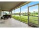 Relax on this screened-in patio that offers great views of the lake and landscaped backyard at 2275 Pearl Cider St, Orlando, FL 32824