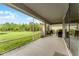This screened patio has room for a table and chairs and looks out over a pond and green space at 2275 Pearl Cider St, Orlando, FL 32824