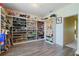 Spacious walk-in closet with custom shelving for shoes, accessories and rod for clothing at 2275 Pearl Cider St, Orlando, FL 32824