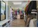 Expansive walk-in closet with custom shelving and rods for clothes and accessories at 2275 Pearl Cider St, Orlando, FL 32824