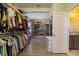 Spacious walk-in closet equipped with custom shelving, ample storage for clothing, and shoe display at 2275 Pearl Cider St, Orlando, FL 32824
