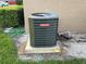Goodman A/C unit with green coils set outside on a concrete pad with grass around it at 228 Everest Pt # 108, Casselberry, FL 32707