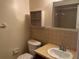 Standard bathroom with a single sink vanity, toilet, and an overhead shelf unit at 228 Everest Pt # 108, Casselberry, FL 32707
