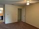 Bedroom with neutral walls and ceiling fan, adjacent to an open doorway at 228 Everest Pt # 108, Casselberry, FL 32707