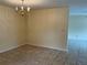 Open dining room featuring tiled flooring and a charming chandelier at 228 Everest Pt # 108, Casselberry, FL 32707