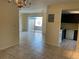 Open living space with tiled floors, chandelier and a view of the outdoor patio at 228 Everest Pt # 108, Casselberry, FL 32707