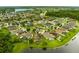 Overhead view of a well kept neighborhood surrounding a lake, with trees and greenery all around at 2360 Brewerton Ln, Orlando, FL 32824
