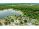 Gorgeous aerial perspective showcasing a neighborhood near a lake, complete with well-manicured lawns and mature trees at 2360 Brewerton Ln, Orlando, FL 32824