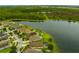 Stunning aerial shot showcasing the home's proximity to a beautiful lake and lush green surroundings at 2360 Brewerton Ln, Orlando, FL 32824
