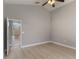 This bedroom has neutral paint and access to the front of the house through an adjacent room at 2360 Brewerton Ln, Orlando, FL 32824