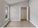 This bedroom features a walk-in closet, neutral paint, and attractive wood-look flooring at 2360 Brewerton Ln, Orlando, FL 32824