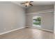 Neutral bedroom featuring wood floors, high ceiling, and view of pool at 2360 Brewerton Ln, Orlando, FL 32824