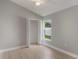 Bright bedroom with hardwood floors and closet at 2360 Brewerton Ln, Orlando, FL 32824