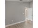 Neutral bedroom featuring wood floors, and open door to other rooms at 2360 Brewerton Ln, Orlando, FL 32824