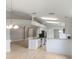 Bright kitchen featuring white cabinets, stainless steel appliances and hardwood floors at 2360 Brewerton Ln, Orlando, FL 32824