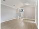 Spacious living area featuring light, wide plank flooring and a vaulted ceiling at 2360 Brewerton Ln, Orlando, FL 32824