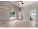 This main bedroom features a walk-in closet and an adjacent bathroom with a tub at 2360 Brewerton Ln, Orlando, FL 32824