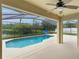 This inviting screened-in pool area has a view of the lake at 2360 Brewerton Ln, Orlando, FL 32824