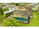 A screened in pool and patio are surrounded by a well maintained yard and a community of similar homes at 2360 Brewerton Ln, Orlando, FL 32824
