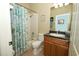 Bathroom featuring a shower, toilet, and stylish vanity with a sink at 2362 Prairie Dunes, Clermont, FL 34711