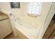 Inviting bathroom featuring a separate soaking tub and tiled surround at 2362 Prairie Dunes, Clermont, FL 34711