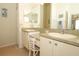 Bathroom featuring double sinks, a large mirror, and great natural light at 2362 Prairie Dunes, Clermont, FL 34711