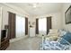 Bedroom with neutral carpet, curtains, and a comfortable-looking day bed at 2362 Prairie Dunes, Clermont, FL 34711