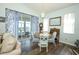 Bright dining area with a chandelier and sliding glass doors to the patio at 2362 Prairie Dunes, Clermont, FL 34711