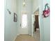 Inviting foyer featuring tile flooring and decorative lighting fixture at 2362 Prairie Dunes, Clermont, FL 34711