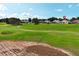 Scenic view of a golf course and community homes, with a partly cloudy sky above at 2362 Prairie Dunes, Clermont, FL 34711
