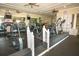 Fully equipped fitness center with treadmills, stationary bikes, and mirrored walls for a complete workout at 2362 Prairie Dunes, Clermont, FL 34711
