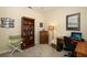 Cozy home office with a wooden desk, carpet floors, and built-in shelves at 2362 Prairie Dunes, Clermont, FL 34711