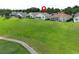 A stunning view of the home's exterior with a well-maintained green lawn at 2362 Prairie Dunes, Clermont, FL 34711