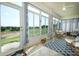 Bright sun room with views, tile floors, and charming wicker furniture at 2362 Prairie Dunes, Clermont, FL 34711