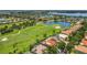 Stunning aerial view of the community, golf course, lakes, and lush landscaping at 2388 Baronsmede Ct, Winter Garden, FL 34787