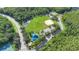 Aerial view of a community recreation area with soccer field, baseball diamond, and playground at 2388 Baronsmede Ct, Winter Garden, FL 34787
