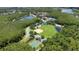 Aerial view of the recreation fields with a basketball court, baseball field, and ponds at 2388 Baronsmede Ct, Winter Garden, FL 34787