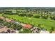 Panoramic aerial view of the community, golf course, and surrounding lakes at 2388 Baronsmede Ct, Winter Garden, FL 34787