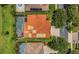 Aerial view of the property featuring a tile roof, screened-in pool, and well-maintained landscaping at 2388 Baronsmede Ct, Winter Garden, FL 34787