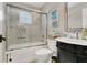 Well-lit bathroom with vanity, bathtub, and shower featuring updated decor at 2388 Baronsmede Ct, Winter Garden, FL 34787