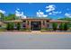 Elegant community clubhouse with landscaped entrance, offering a welcoming space for residents to gather and socialize at 2388 Baronsmede Ct, Winter Garden, FL 34787