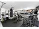 Spacious garage equipped as a gym, complete with workout equipment and ample space at 2388 Baronsmede Ct, Winter Garden, FL 34787
