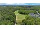 Scenic aerial view of the golf course surrounded by lush green trees at 2388 Baronsmede Ct, Winter Garden, FL 34787