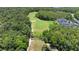 Scenic aerial view of the golf course with lush green trees at 2388 Baronsmede Ct, Winter Garden, FL 34787